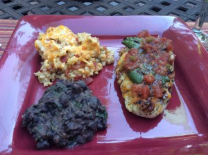 I added cheese and salsa to my dish served alongside Mexican Rice Casserole and Refried Black Beans
