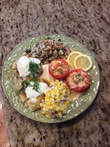 Feta Stuffed tomato as a side dish to Crab Cakes and sides of fried corn and vegetable rice pilaf