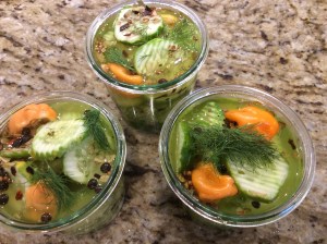 Cover pickles with vinegar and top with additional dill and chives