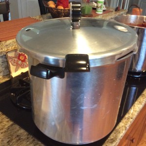 Although this is a pressure canner, I am using it as a water bath..the lid is just sitting loosely on top to keep the water at a boil during the processing