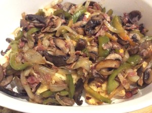 Place chicken in the bottom of the casserole dish. Next, cover with the sautéed vegetables.
