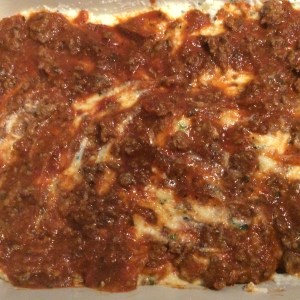 Add more meat sauce on top of ricotta mixture