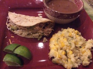 Pork Carnitas served with Mexican Pinto Beans and Sour Cream Rice